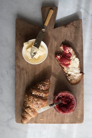 Served breakfast meal with sandwich and jam