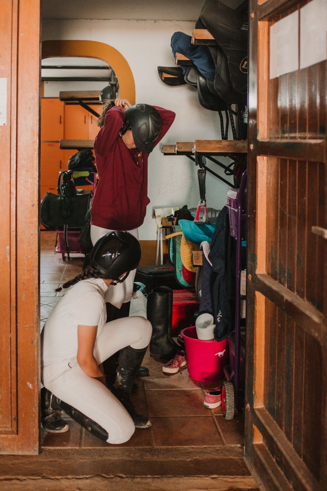 Women preparing for horse riding