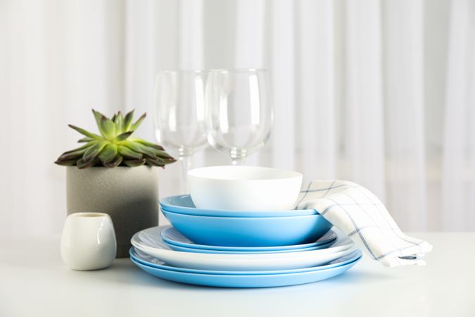 Cutlery with succulent plant stacked on table, space for text