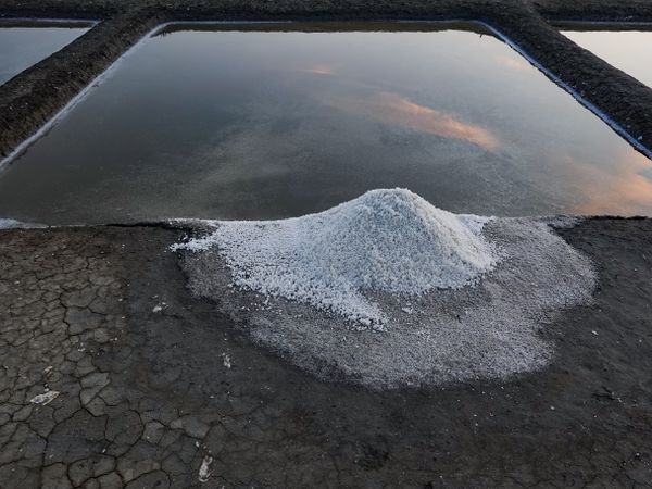 Salt mound on the edge of its salt pan