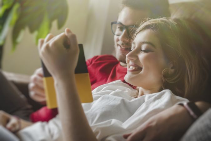 Dreamy couple with brochure