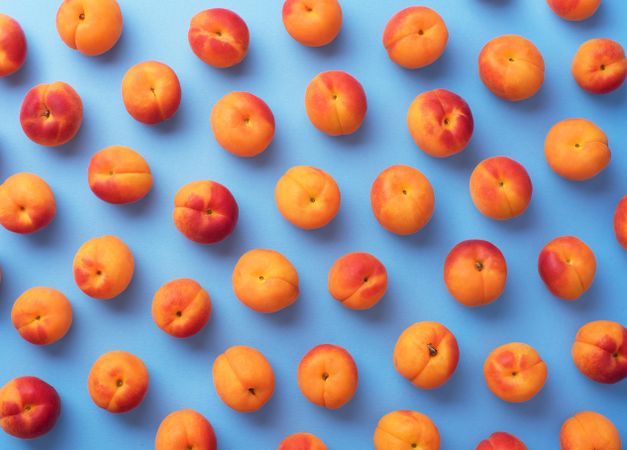 Apricots on blue background