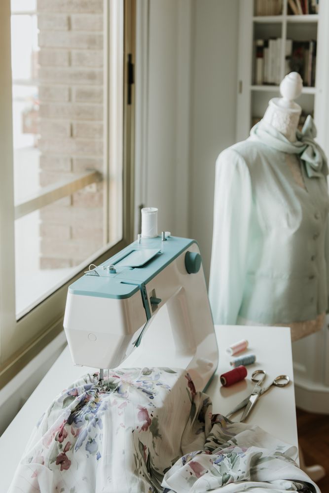 Dummy with blouse near sewing machine