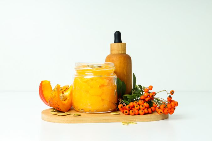 Skin care and face care concept - pumpkin cosmetic