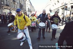 London, England, United Kingdom - March 19 2022: Men playing drums at protest 4BOndb