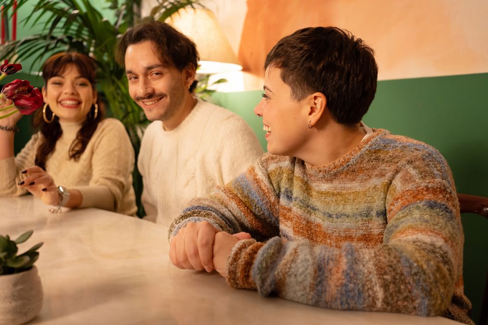 Group of happy diverse friends enjoying a cozy evening together in a bar