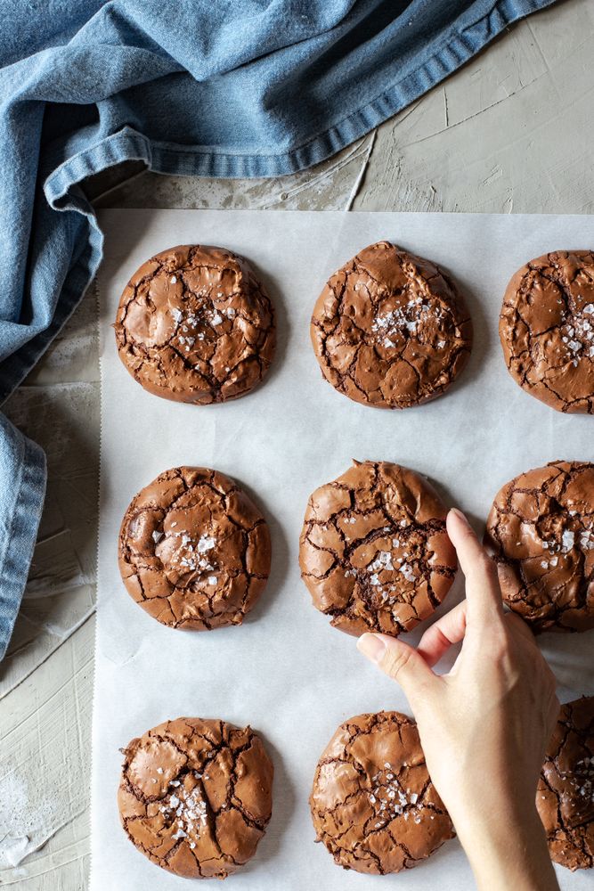 Homemade brownie cookies arranged on baking paper