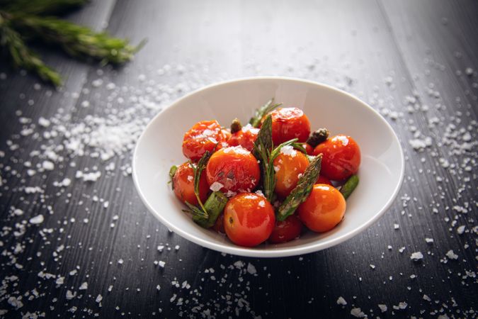 Fresh cherry tomatoes sauteed with green asparagus and rosemary
