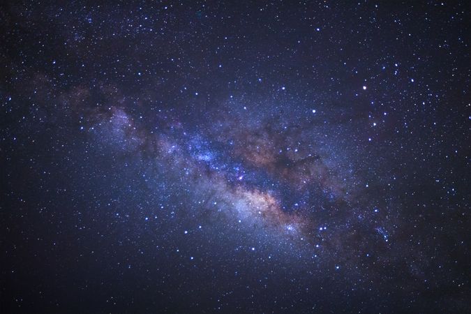 Milky way galaxy with stars and space dust in the universe, Long exposure photograph, with grain.