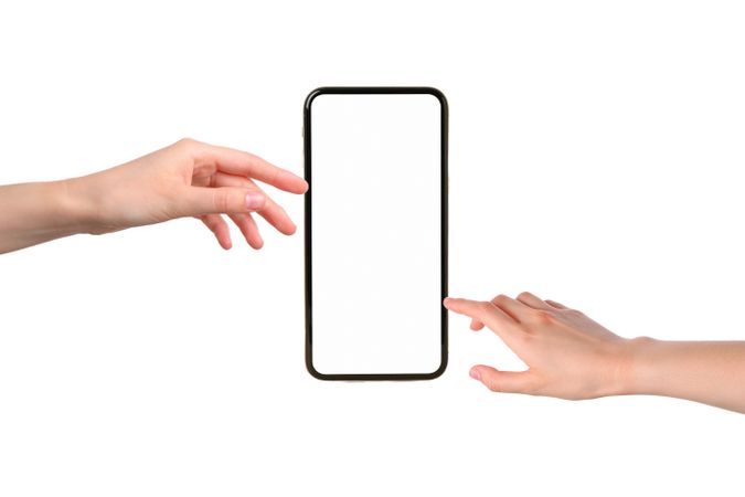 Two hands reach for an empty smartphone screen