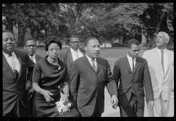 Martin Luther King and other civil rights activists arrive for meeting with President LBJ