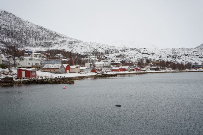 Picturesque town in calm lake in winter
