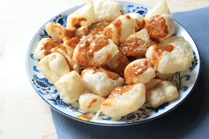Kerupuk Rambak, Crackers Made from Cow Skin. Jangek Karupuak in Curry Sauce.