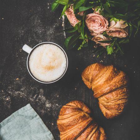 Coffee with croissants and pink roses, square crop