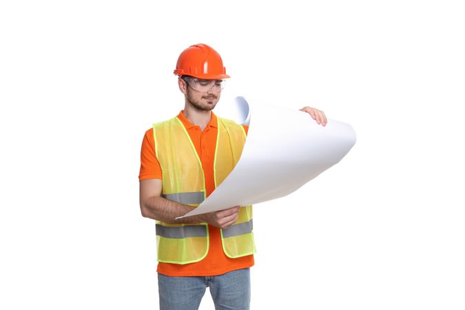 Engineer in helmet with drawing paper, isolated on light background
