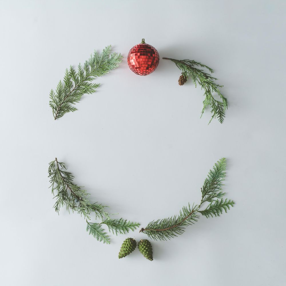 Christmas round frame made with natural winter evergreen tree branche