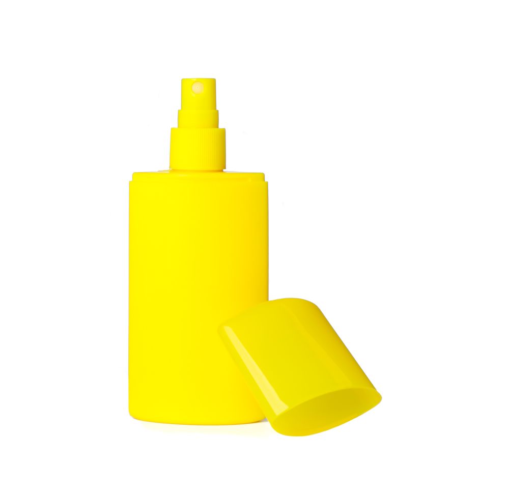 Sunscreen spray isolated on plain background. Summer vacation accessories