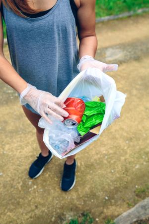 Woman showing garbage