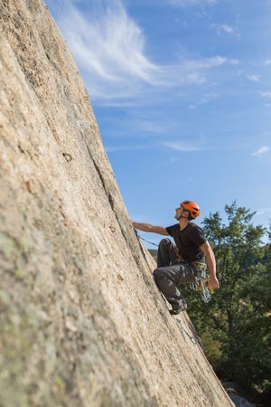 Man climbing a rock