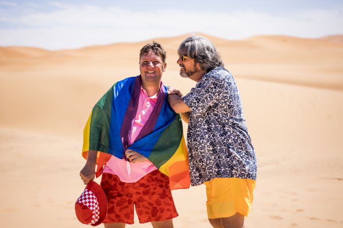 Excited gay couple in desert