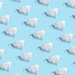 Medical mask pattern on pastel blue background
