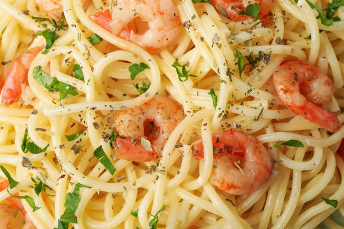 Tasty pasta with shrimps on whole background, close up