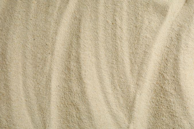 Clear sea sand as background, space for text and closeup. Summer vacation background