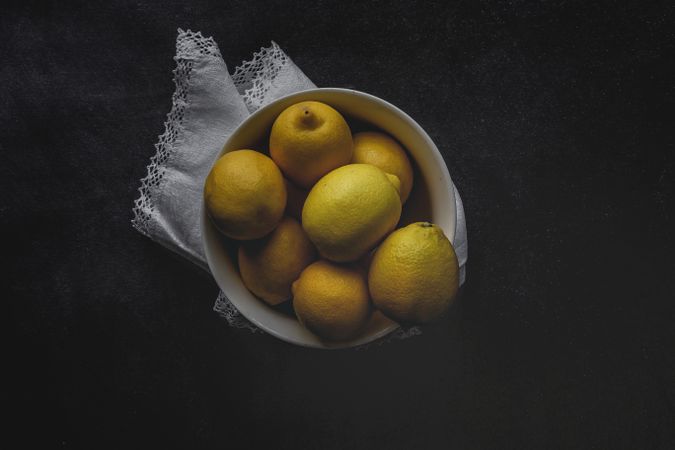 Fresh lemons on dark background.