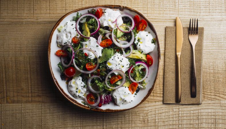 Vegetables salad with onion greens and cream sauce