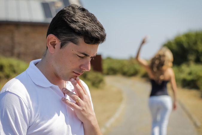 Unhappy man and angry woman leaving after quarrel