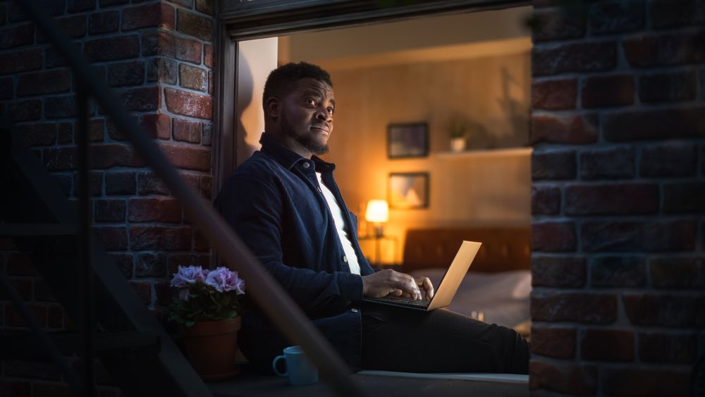 Creative Male Checking Social Media, Browsing Internet, Investing. Urban City Lifestyle