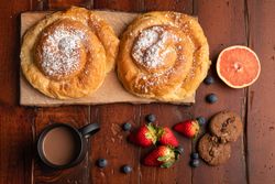 Breakfast food and drink on wooden table