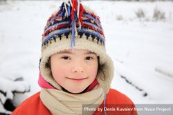 Portrait of young child playing in the cold weather 0LYJA5