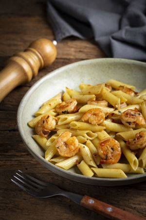 Penne pasta with grilled shrimp.