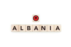 Wooden blocks bearing the name and flag of Albania.