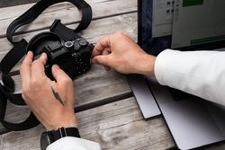 Man with camera and laptop