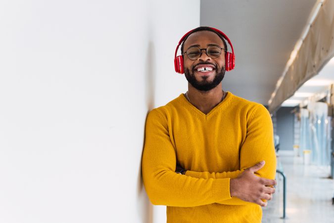 Black man listening to music in headphones