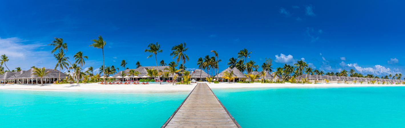 Walkway leading to a tropical beach