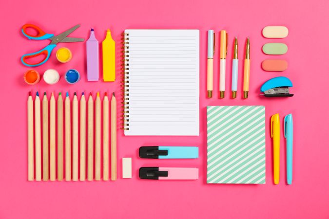 Flat lay composition with stationery on pink background, space for text