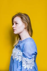 Blonde woman posing in studio