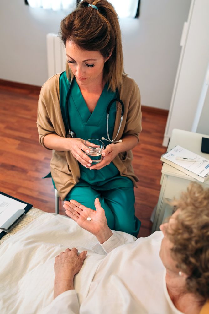 Doctor giving medication dose to mature patient