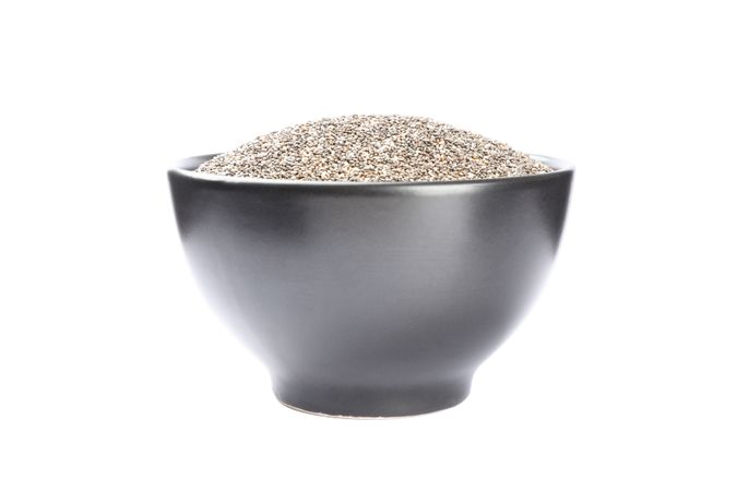 Chia seeds and bowl isolated on plain background