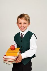 Portrait handsome schoolboy in uniform in front