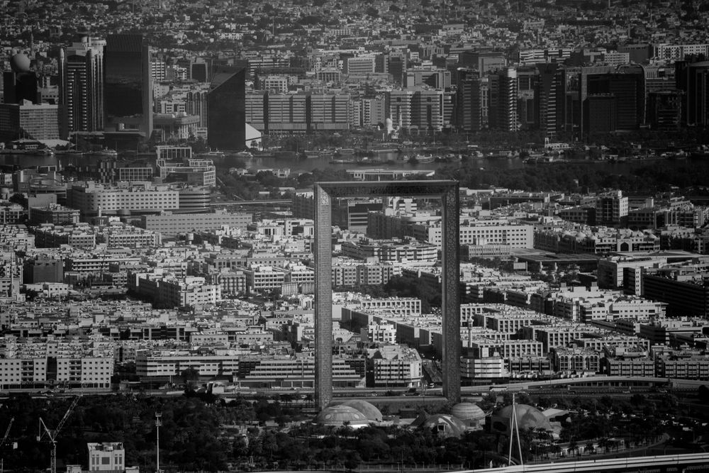 Grayscale photo of Dubai frame building in UAE