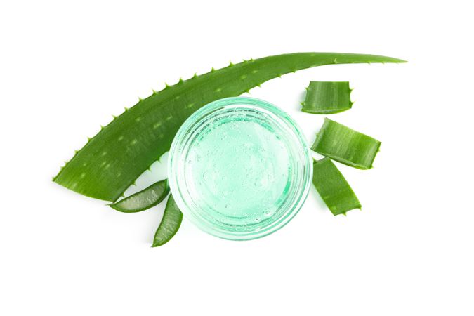Composition with natural treatment accessories isolated on blank background. Aloe vera