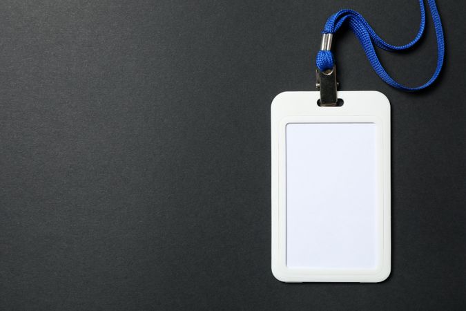 Empty name tag on dark background, space for text