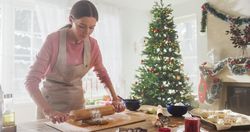 Portrait of Female Chef Preparing Dough and Making Gingerbread for Christmas at Home.