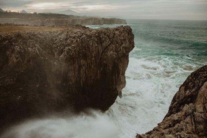 edge of cliff near water