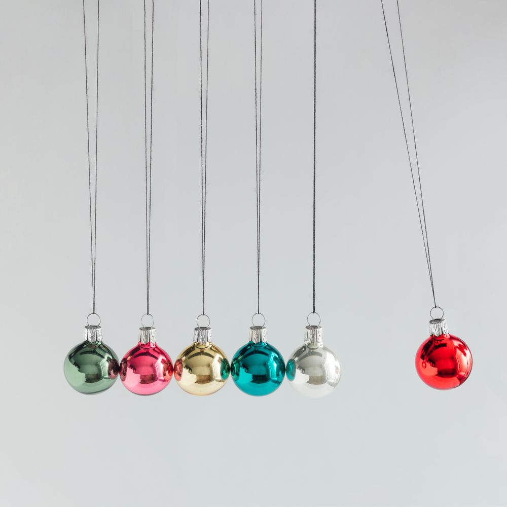 Colorful Christmas baubles decoration, on light background with copy space