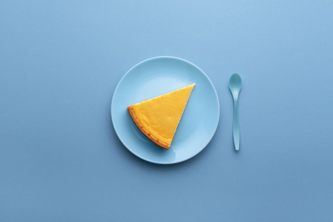 Cheesecake slice on blue plate